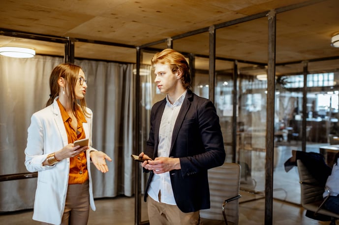 business-man-and-woman-talking-in-the-office-2023-11-27-04-51-05-utc